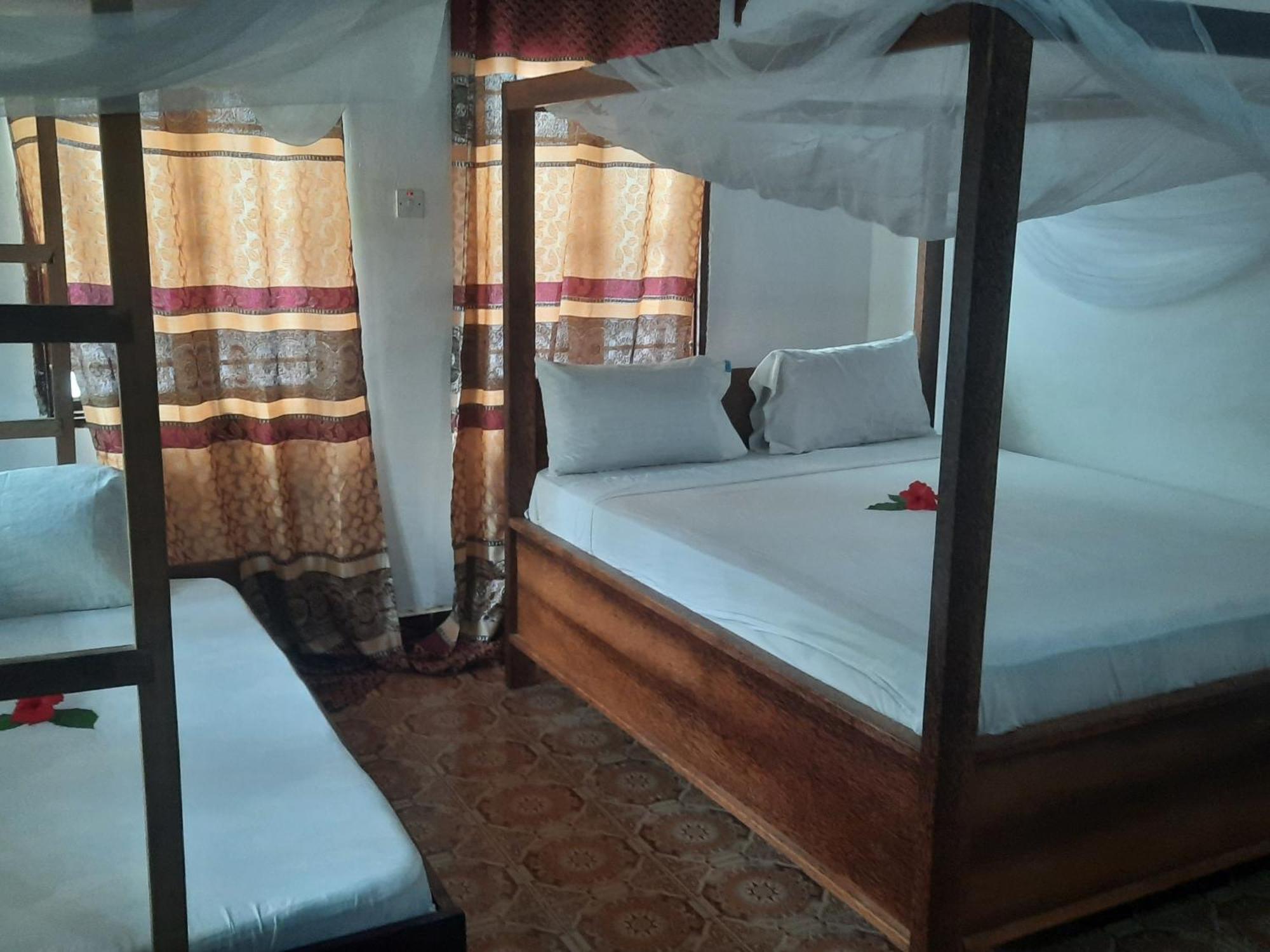 Ames Nungwi Bed and Breakfast Rum bild