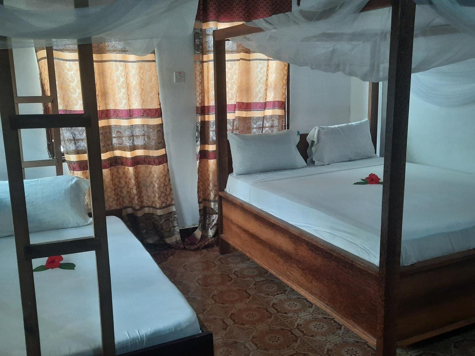 Ames Nungwi Bed and Breakfast Rum bild